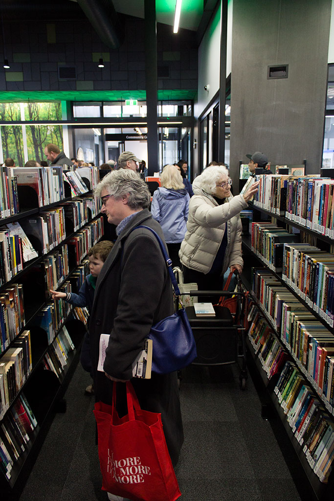 Image of Members of the public browse the shelves of their new library Saturday, 22 July 2017