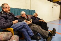 Thumbnail Image of Men listen to the guest speaker at Fishing and Casting Club