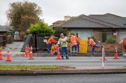Thumbnail Image of Road workers installing internet fibre cable, Harewood Road