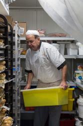 Thumbnail Image of Head chef at Copenhagen Bakery grabbing food from the freezer