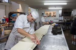 Thumbnail Image of Apprentice chef preparing pastry at Copenhagen Bakery