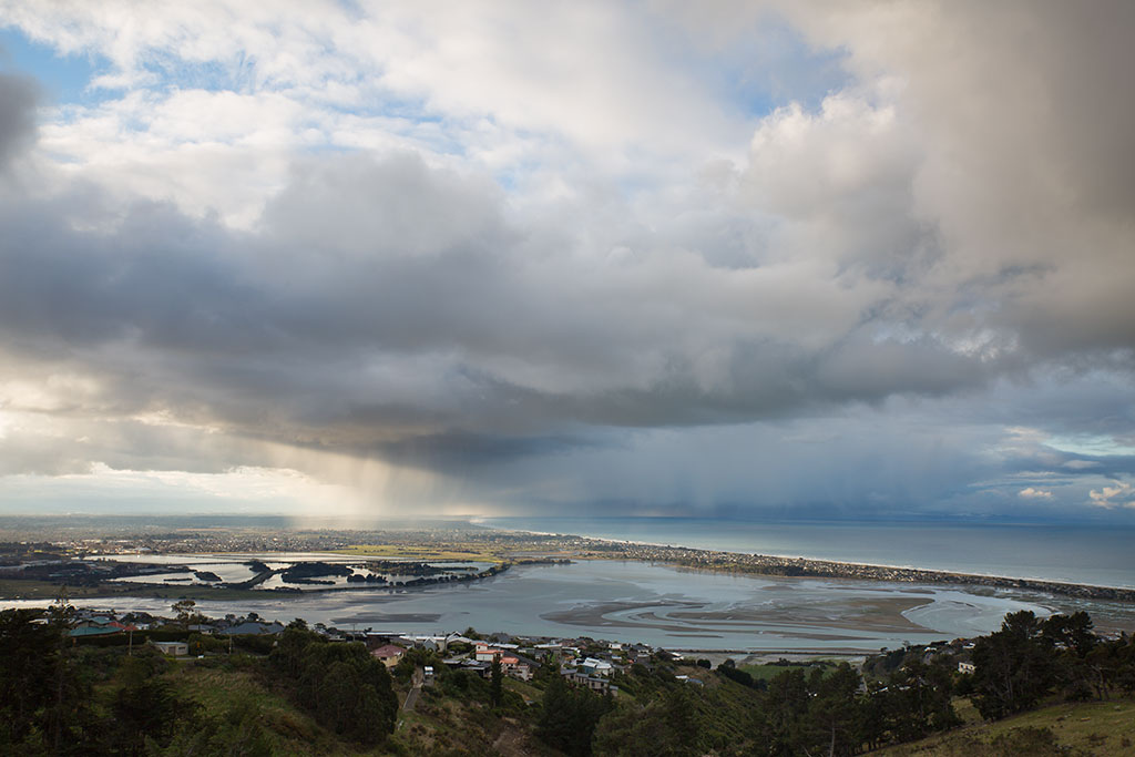 Image of View of New Brighton from across the estuary on the Port Hills. 06-08-2016 5:34 p.m.