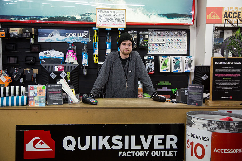 Image of Blake, shop assistant, Quiksilver Factory Outlet, Beresford Street, New Brighton. Monday, 15 August 2016
