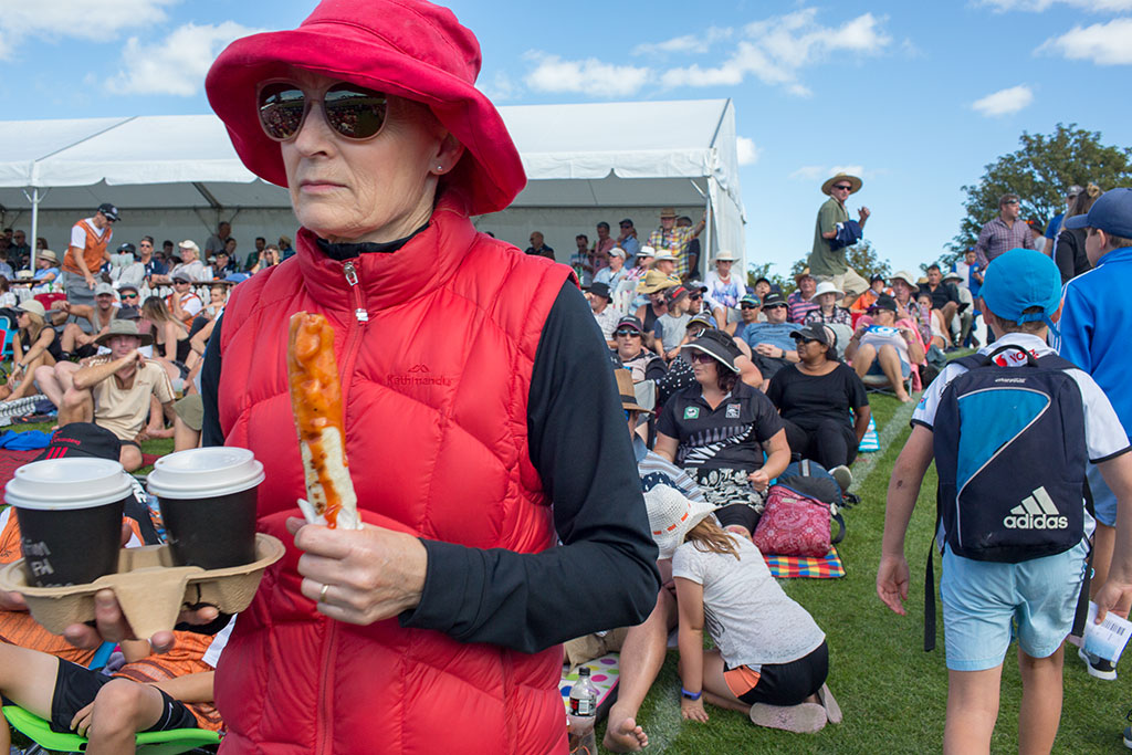 Image of Woman with food at the Blackcaps vs England cricket game, Hagley Oval. Saturday, 10 March 2018