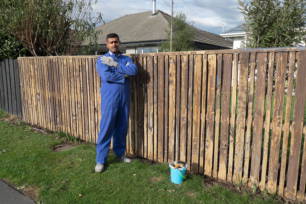 Image of Ashwin painting the fence at Checketts Avenue. 18-05-15 10.20 p.m.