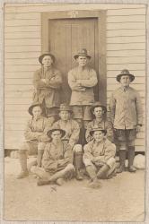 Thumbnail Image of Photograph of soldiers, outside a hut.