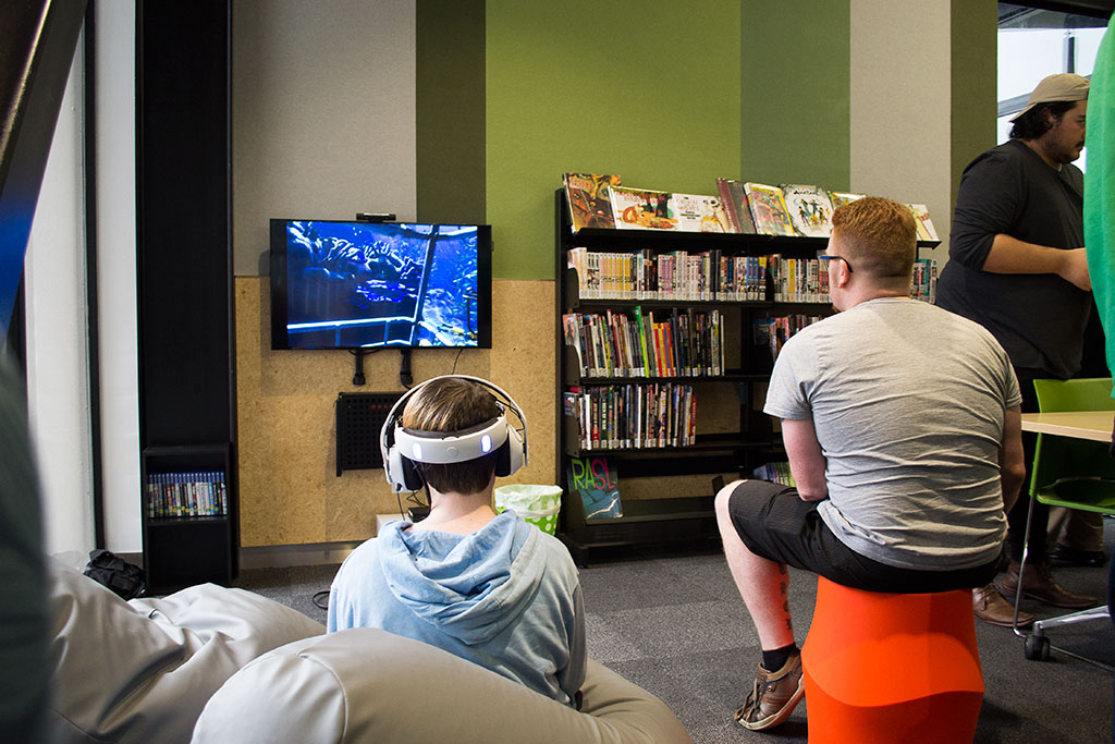 Image of Playing a virtual reality game, opening, Ōrauwhata : Bishopdale Library Saturday, 22 July 2017