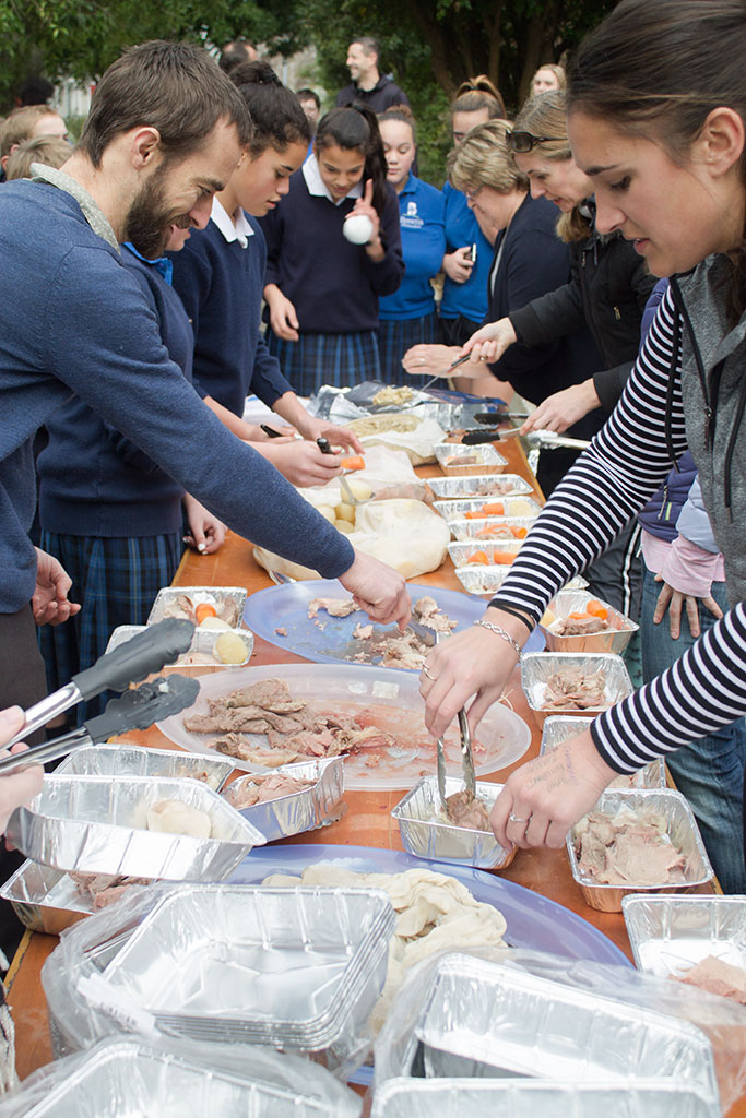 Image of Breens Intermediate teachers serve food cooked in a hāngī Friday, 30 June 2017