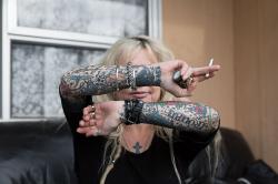 Thumbnail Image of Millie shows her tattooed arms
