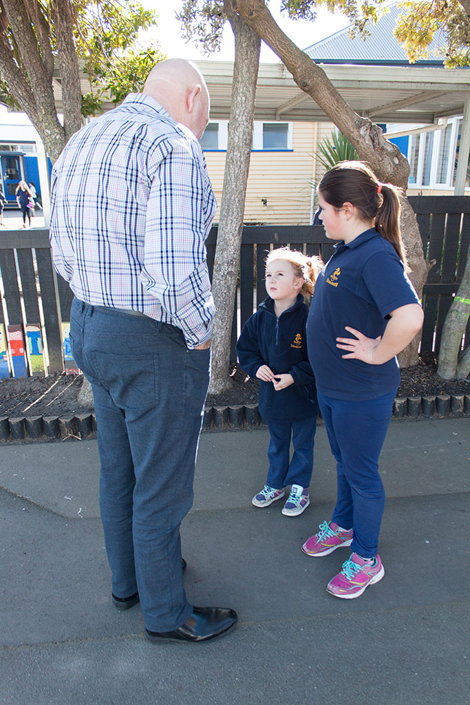 Image of Two students ask their principal for help with a problem, South New Brighton School. Thursday, 28 July 2016
