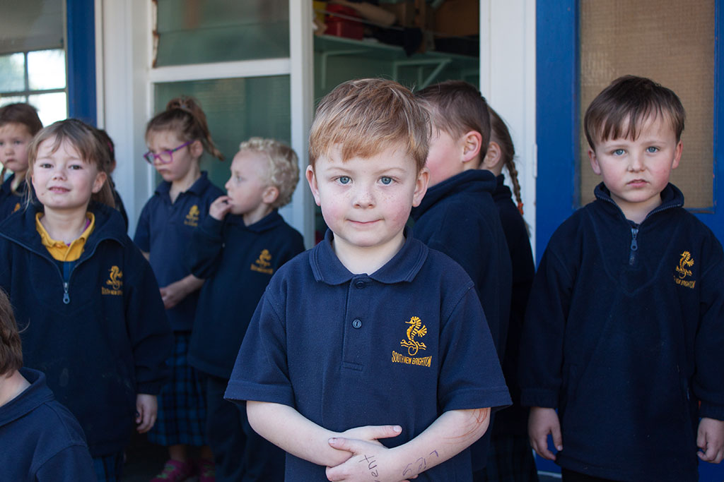 Image of A student waiting outside class, South New Brighton School. Thursday, 28 July 2016