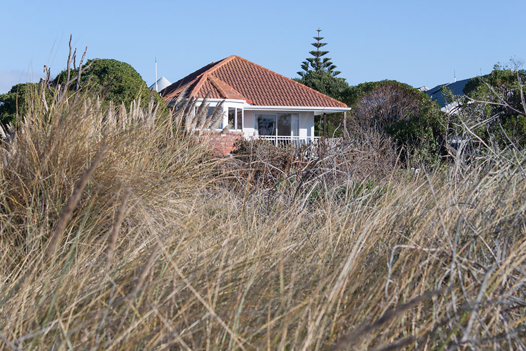 Image of View of a house from reserve, Rocking Horse Road, Southshore. Friday, 15 July 2016