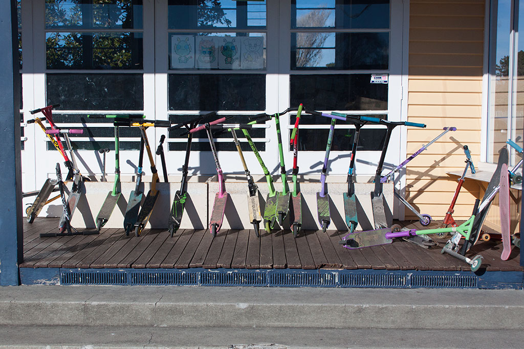 Image of Scooters stored outside a classroom, South New Brighton School. Thursday, 28 July 2016