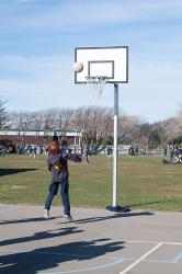Thumbnail Image of A student plays with a basketball, South New Brighton School