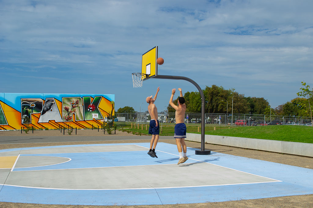 Image of Two friends playing basketball on the new courts, Manchester Street. Wednesday, 21 March 2018