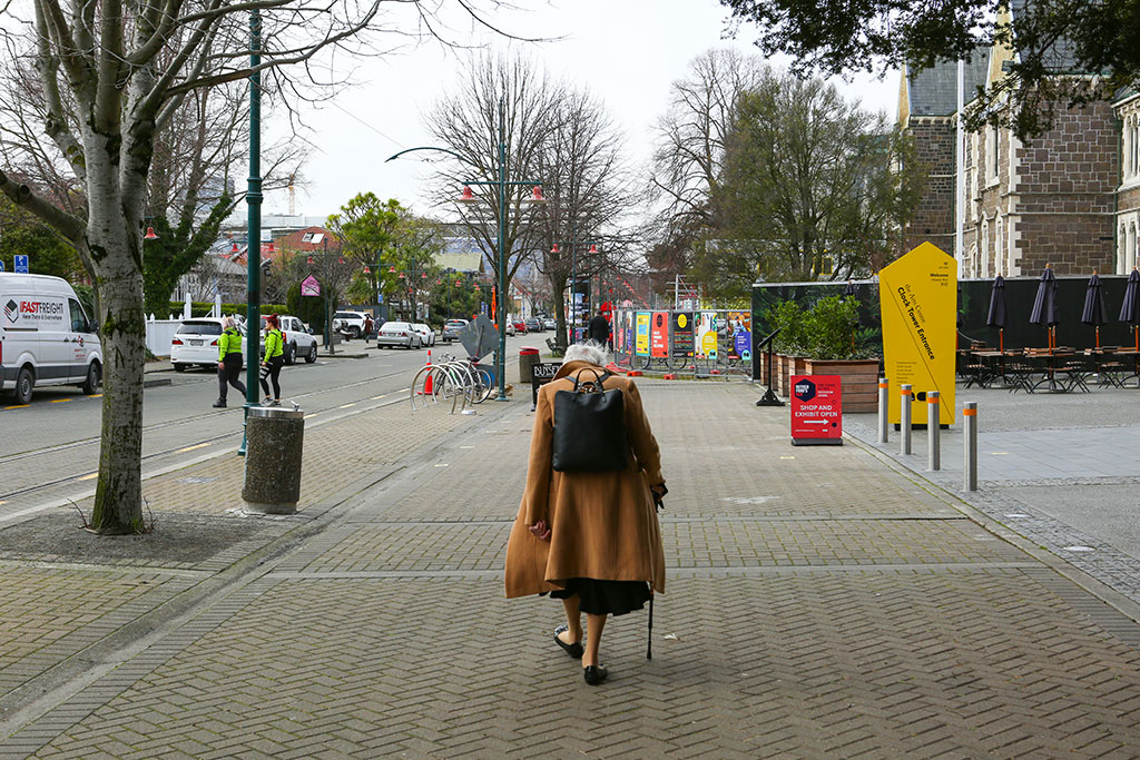 Image of Woman walking down Worcester Street. Sunday, 8 July 2018