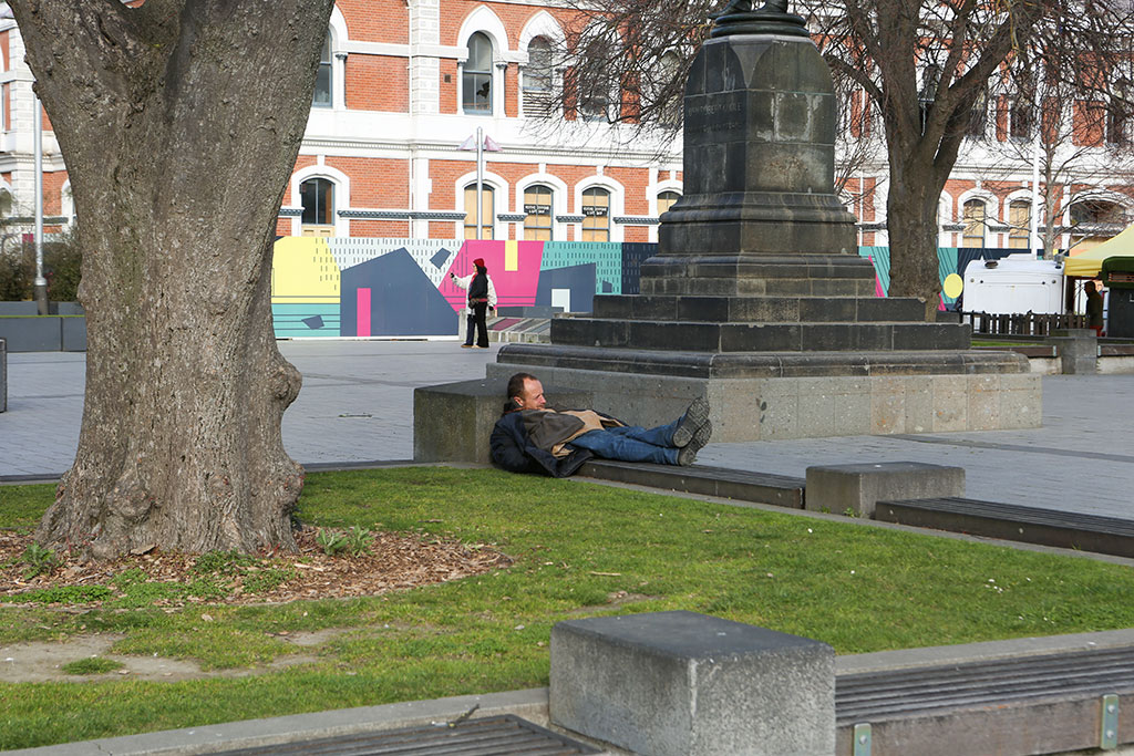 Image of A man sleeping in the square at lunchtime, Cathedral Square. Monday, 8 October 2018