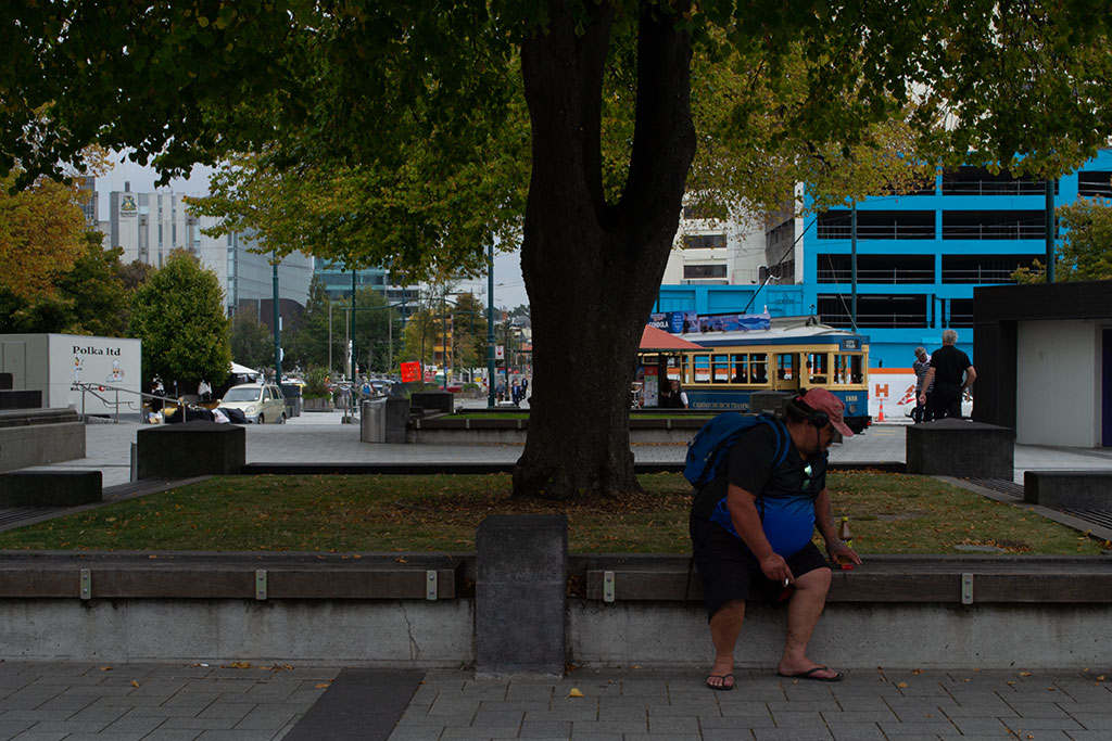 Image of Man sitting in shade, Cathedral Square. Wednesday, 21 March 2018