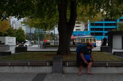 Thumbnail Image of Man sitting in shade, Cathedral Square