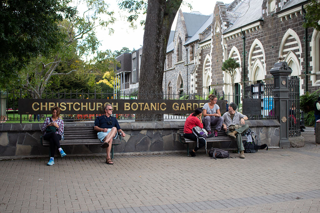 Image of People sitting at the Rolleston Avenue entrance to the Christchurch Botanic Gardens. Wednesday, 7 March 2018