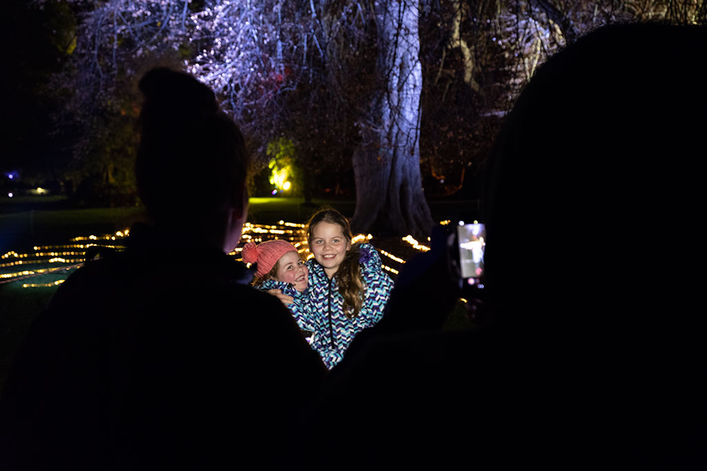 Image of Children smile for a photo at the Botanic D'Lights, Botanic Gardens. Saturday, 11 August 2018