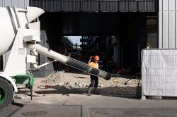 Thumbnail Image of Construction worker backs cement truck