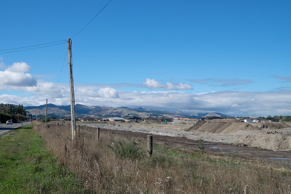 Image of The first stages of a new subdivision being built on Halswell Junction Road, looking towards the Port Hills. 30-03-2015 10.57 a.m.