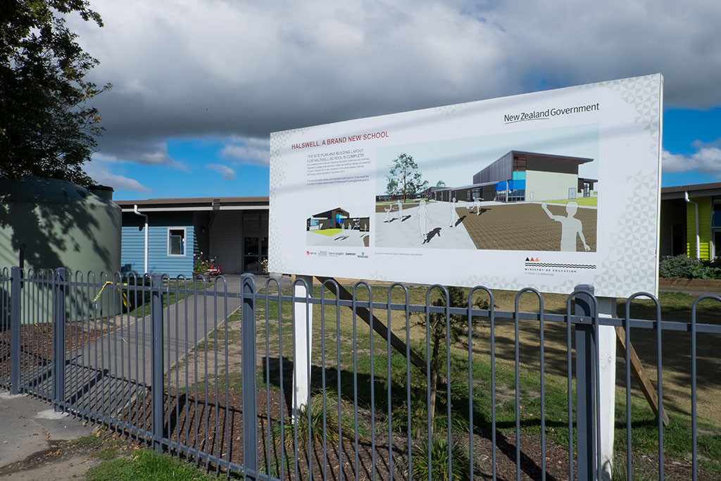 Image of Sign outside Halswell Primary School advertises the new rebuild post earthquake, 437 Halswell Road. 30-03-15 11.39 a.m.
