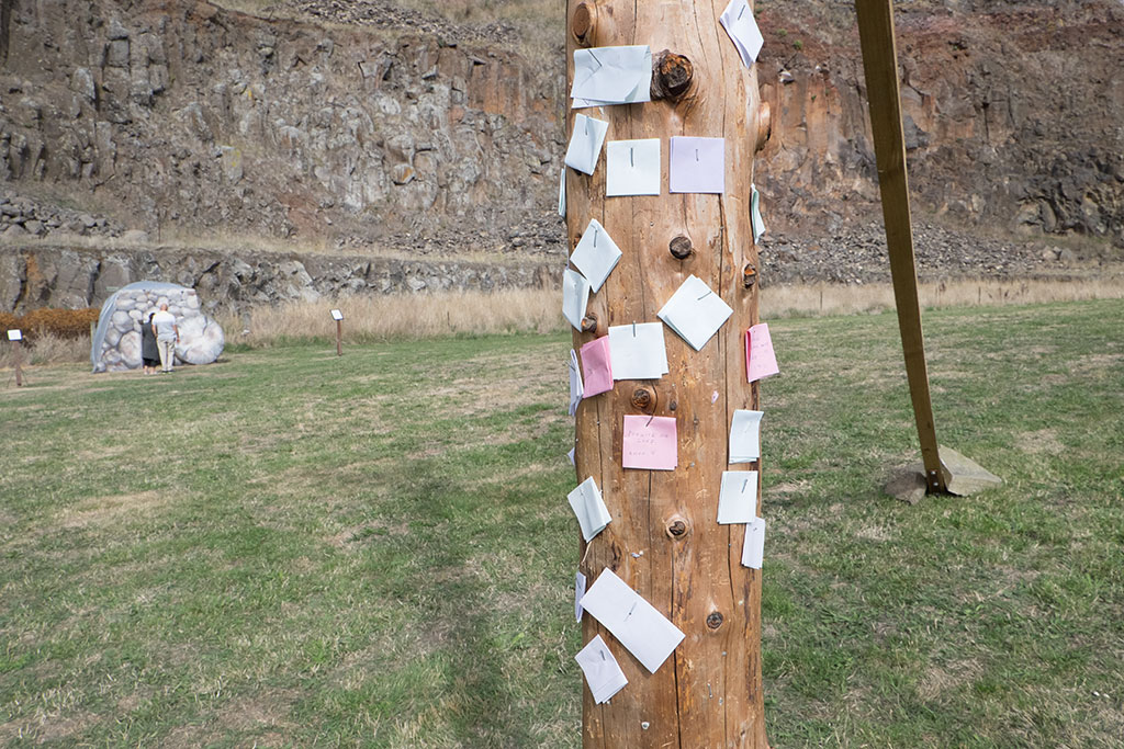 Image of Prayers written by the public nailed to Jesus' cross. Halswell Quarry park. 5-04-15 11.23 a.m.