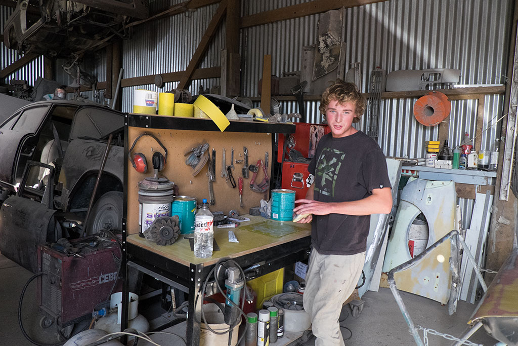 Image of Shaun in the work shop of his father's panel beating business, Rust Repairs, 373 Wigram Road. 15-04-15 12.25 p.m.