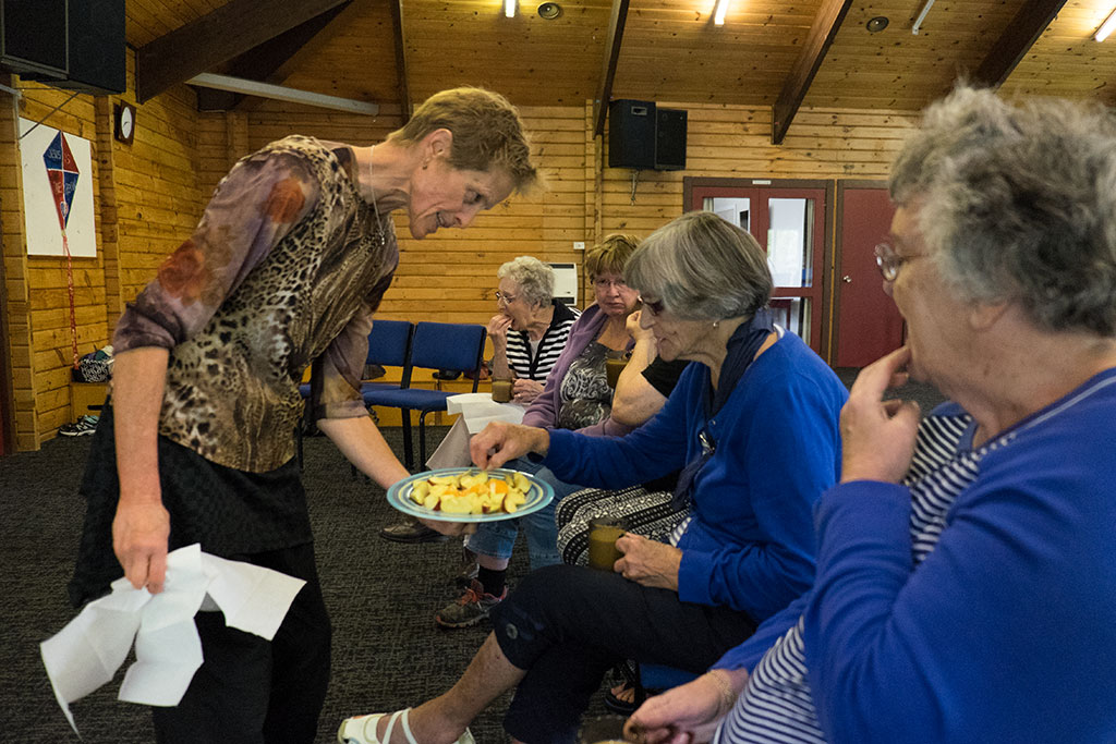 Image of Sarah offers refreshments to participators of Monday Movers after their class, 6 Balcairn Street. 20-04-15 2.38 p.m.
