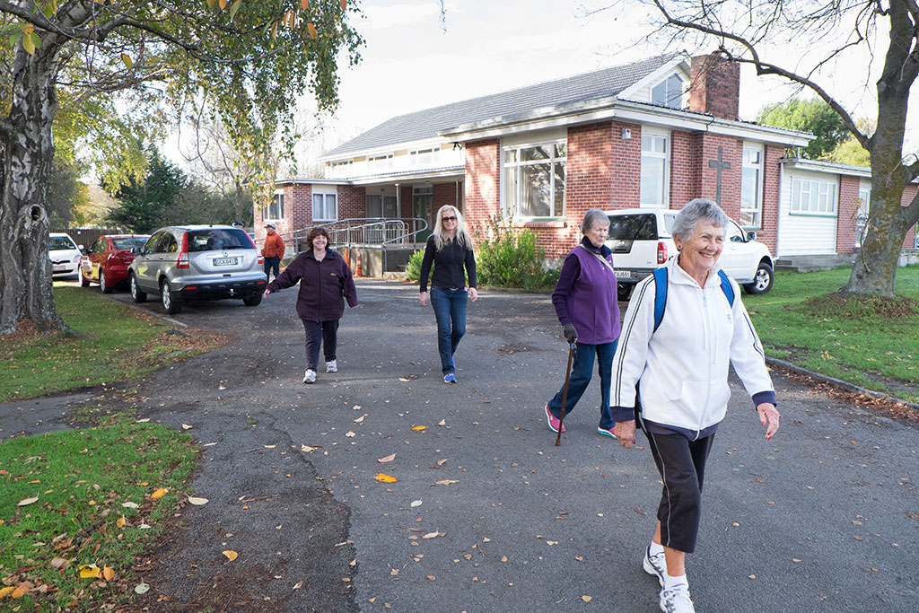Image of The Halswell Walking Club set off on their weekly walk, outside the Saint Mary's Anglican Church. 18-05-15 10.06 a.m.