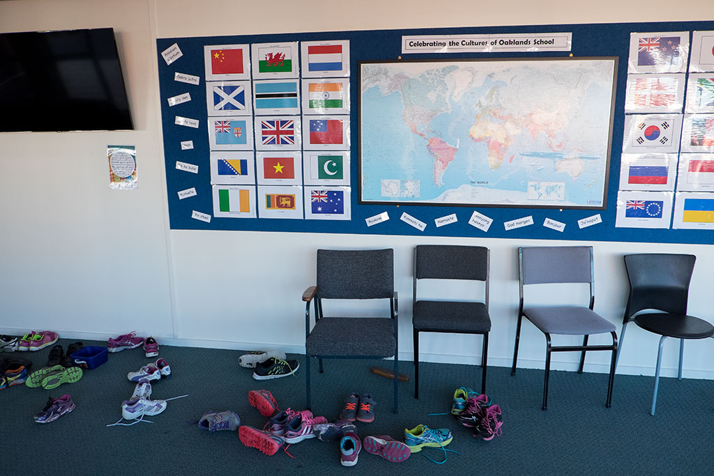 Image of Shoes of students participating in the schools kapa haka group at Oaklands Primary School sit outside the school hall. 29-05-2015 10.49 a.m.