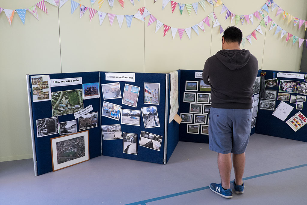 Image of Man looks at the display boards inside Halswell Primary School, at the Winter Carnival and opening day. 1-06-15 1.26 p.m.