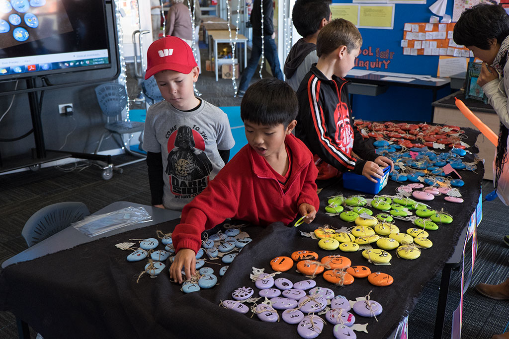 Image of Children sell their painted rocks at the Halswell Primary School Winter Carnival and opening day. 1-06-15 1.44 p.m.