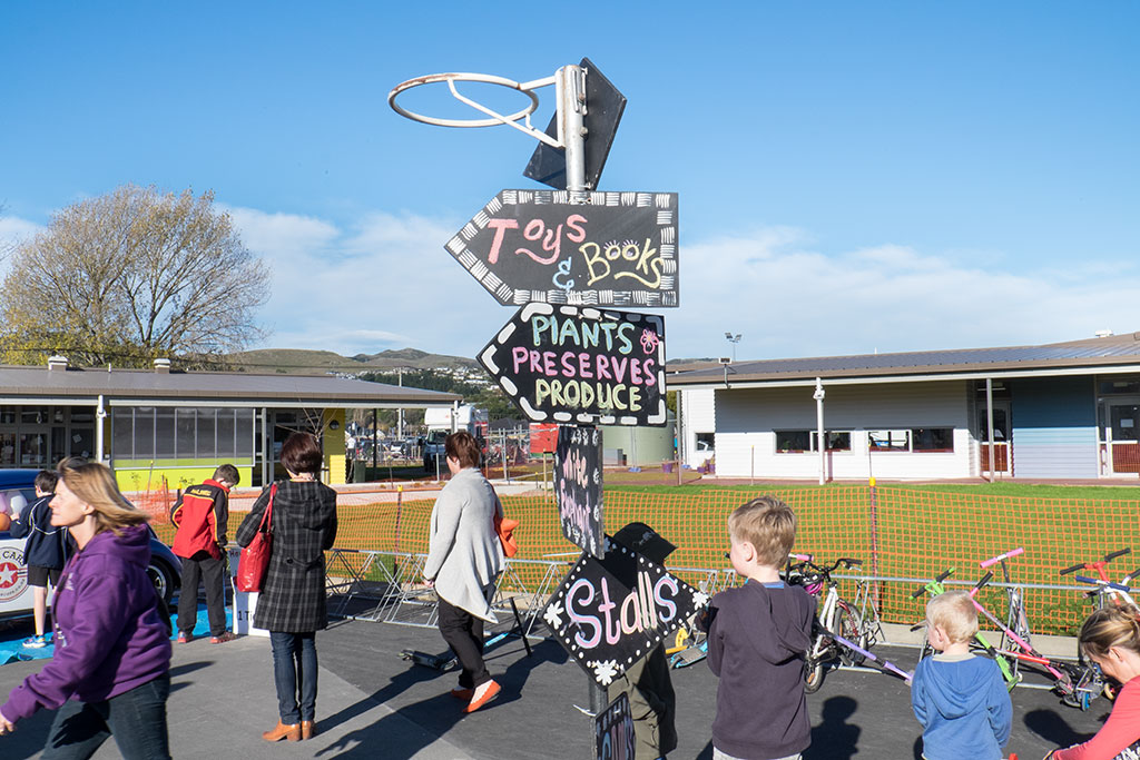 Image of Signs direct carnival goers to various parts of the event at Halswell Primary School Winter Carnival and opening day. 1-06-15 1.57 p.m.