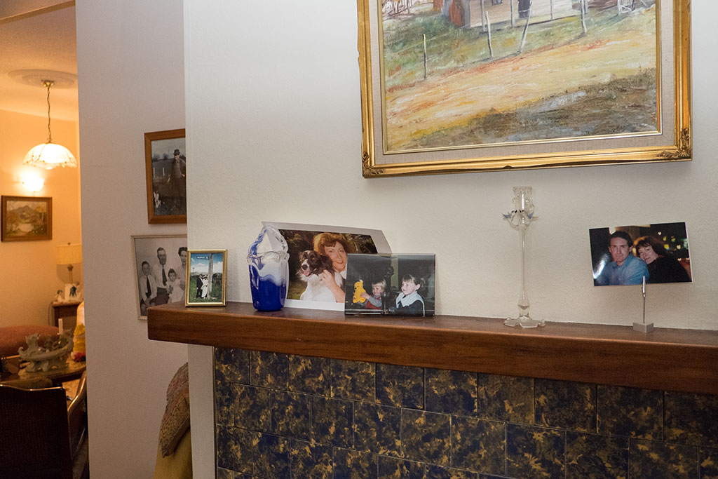Image of Family photographs on Patricia's fireplace. 02-06-15 3.23 p.m.