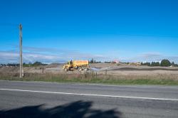 Thumbnail Image of Trucks working on the road for a new subdivision