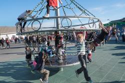 Thumbnail Image of Children swing from playground ride at Halswell Primary School Winter Carnival