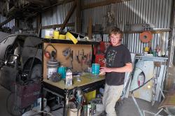 Thumbnail Image of Shaun in the work shop of his father's panel beating business