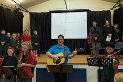 Thumbnail Image of Geoffrey McCallum, music teacher at Oaklands Primary School, performs with students