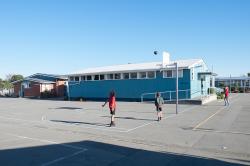 Thumbnail Image of Students play basket ball at the courts at Oaklands Primary School
