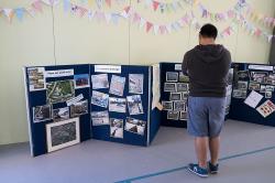 Thumbnail Image of Man looks at the display boards inside Halswell Primary School