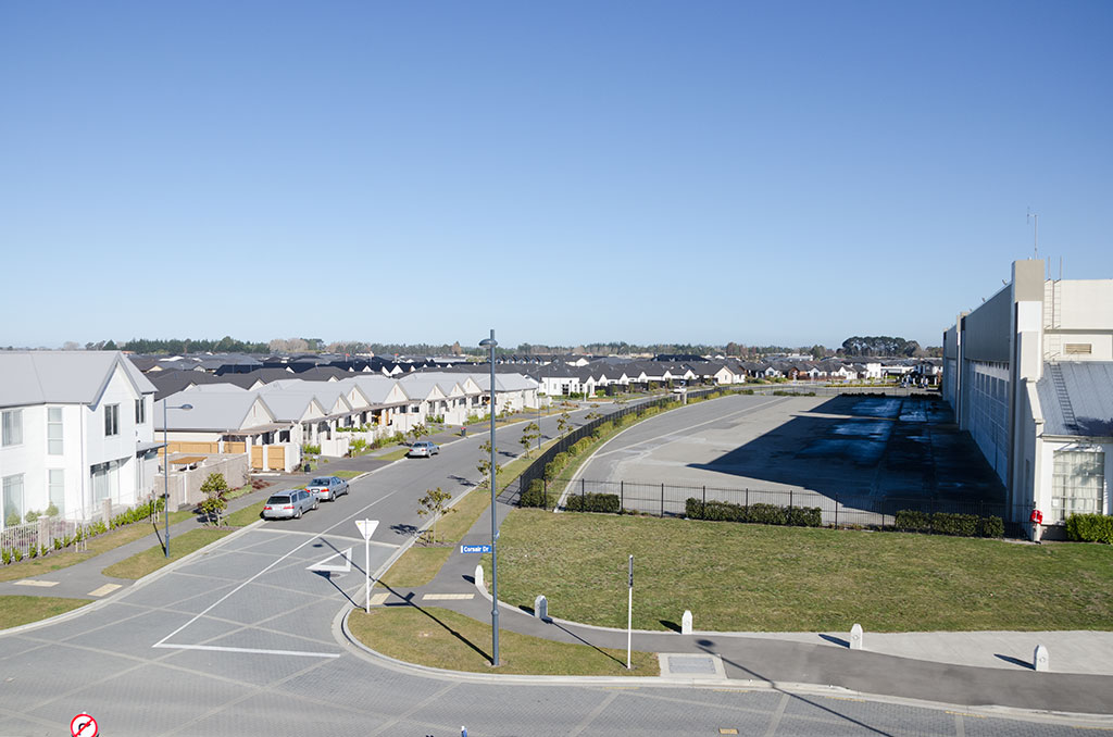 Image of Wigram Skies housing development opposite a RNZAF hangar. 25-07-2015 1:46 p.m.