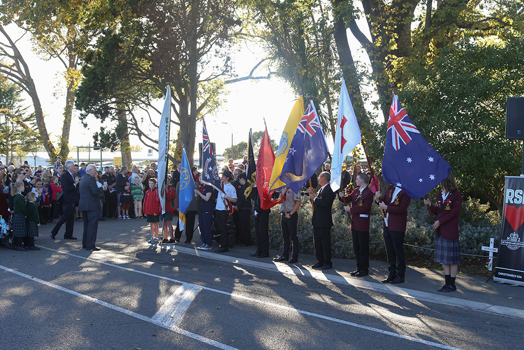 Image of Crowd, with flags, at Halswell ANZAC Day memorial service. 25/04/2015 8:59